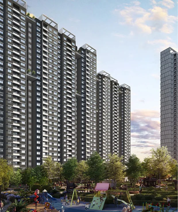 Towers of Adarsh Park Heights rising beyond a landscaped play area