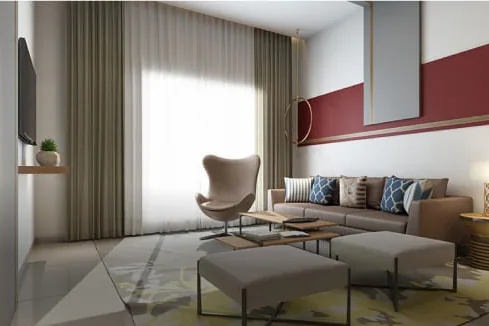 Living room with a sofa set and lounge chair at Adarsh Park Heights